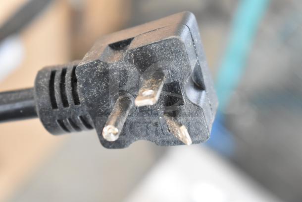 Close-up of a power plug for Galaxy 177GCT10 CT-10 Conveyor Toaster, 120V, showing minor surface dust.