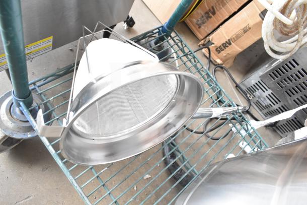 Brand new Galaxy 177GCT10 10" stainless steel bouillon strainer with reinforced frame, minor scratches visible.