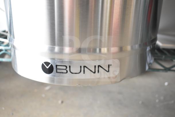 Brand new Bunn 34100.0001 TDO-5 5 Gallon Iced Tea Dispenser with solid plastic lid, slight scratch and dent, visible Bunn logo.