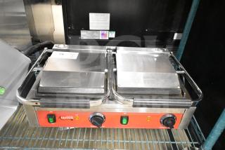 BRAND NEW Avantco 177PG400S dual panini grill with smooth plates, 19 5/8" x 9 1/8" surface, 120V, minor dents visible.