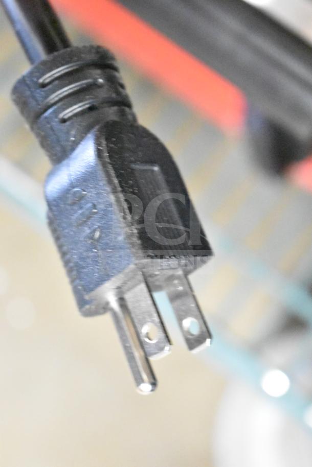 Close-up view of a plug for the Avantco 177PG400S Panini Grill, showing three-prong design for 120V connection.