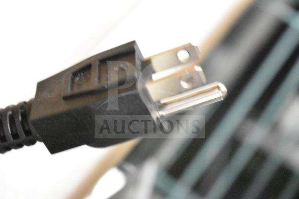 Close-up of a power plug for the Avantco 928IBHD21 Heavy-Duty Variable Speed Immersion Blender, 120 Volts.