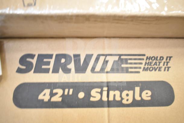 BRAND NEW SCRATCH AND DENT ServIt 42" High Wattage Strip Warmer packaging with "Hold It Heat It Move It" slogan.