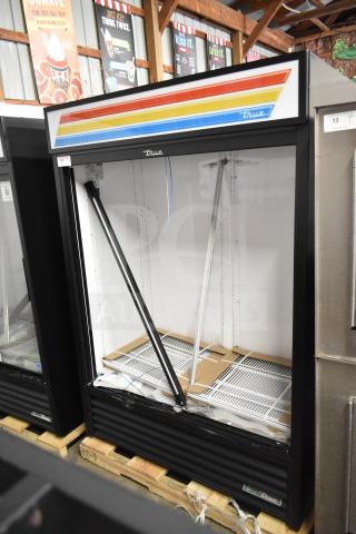 Brand new 2025 True GDM-47-HC-LD commercial cooler merchandiser, missing doors, 115 volts, 1 phase. Features scratch and dent.