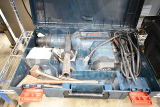 Bosch RH745 Rotary Hammer in hard case. Features 120 volts, 1 phase, with power cord and attachments. Appears in good condition.