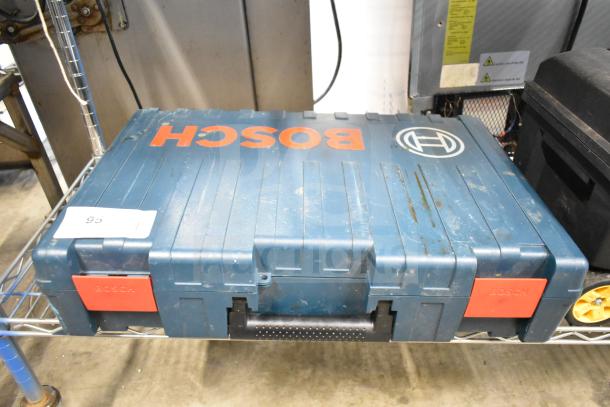 Bosch RH745 Rotary Hammer in sturdy hard case, 120 volts, 1 phase, showing signs of wear.