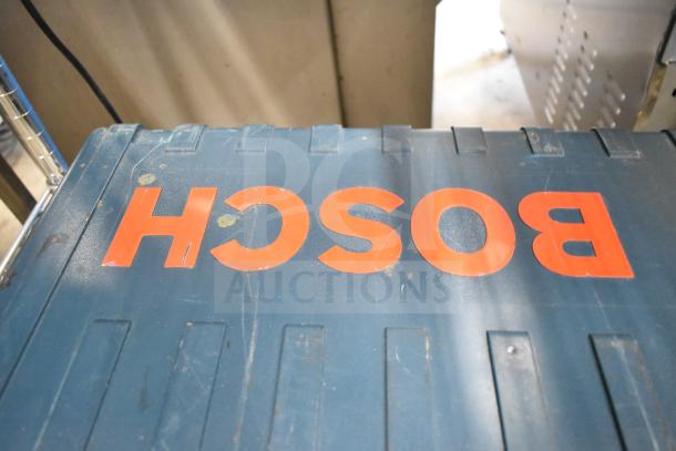 Bosch RH745 Rotary Hammer in blue hard case with visible logo. 120 Volts, 1 Phase. Good condition, minor scuffs.