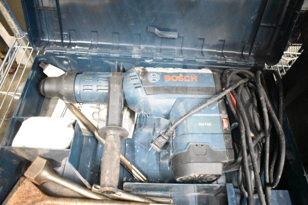 Bosch RH745 Rotary Hammer in hard case, 120V, 1 Phase. Includes handle and power cord. Suitable for heavy-duty use.