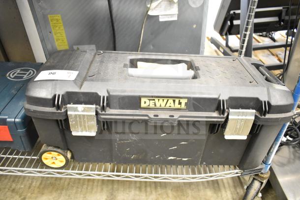 DeWalt hard tool box with handle and metal latches, containing Hilti tool and drill bits. Minor wear visible. Auction item tag 96.