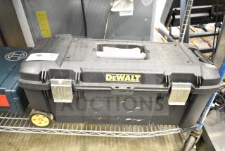 DeWalt hard tool box with handle and metal latches, containing Hilti tool and drill bits. Minor wear visible. Auction item tag 96.