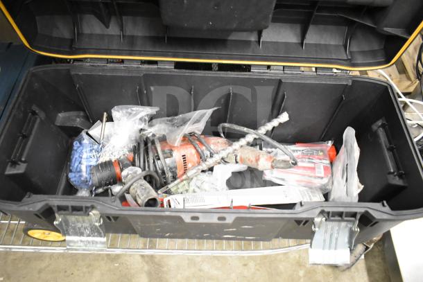 DeWalt hard tool box containing a Hilti tool, drill bits, and various accessories, in good condition.