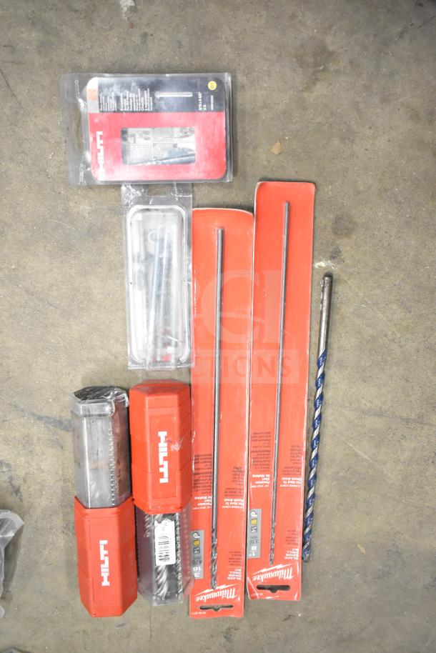 DeWalt tool box with contents, including Hilti drill bits and Milwaukee accessories, in good condition.