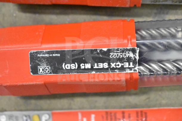 DeWalt hard tool box with contents, including Hilti tool, drill bits in red case labeled "TE-CX Set M5 (SD)" and "Made in Germany".