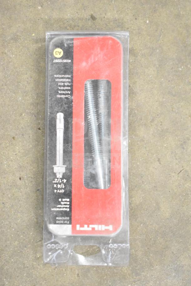 DeWalt hard tool box with contents, including a Hilti tool. Visible Hilti anchor bolts, size 1/4" x 4-1/2" in packaging.