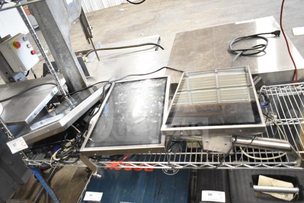 Three electronic items including Kitchen Armor monitor, Thin Client Mini PC, and a third unidentified device on a wire shelf.