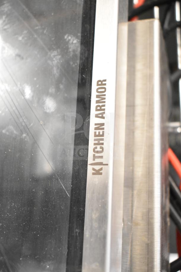 Kitchen Armor monitor with visible branding, showing minor wear. Part of a lot including a Thin Client Mini PC.