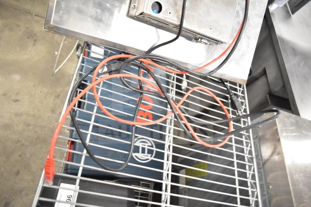 Kitchen Armor monitor and Thin Client Mini PC with cables on a metal rack. Items appear in used condition.