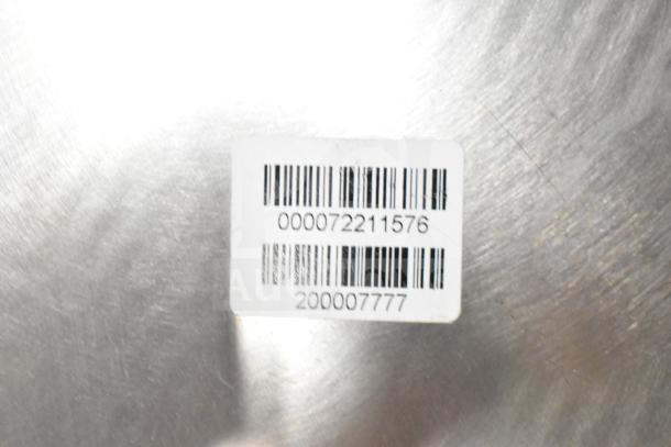Barcode label on a metal surface with numbers 000072211576 and 200007777. Condition appears clean and intact.
