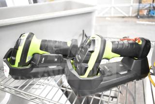 Two Zebra DS3578 barcode scanners with charging bases, black and green, used condition, visible brand logo.