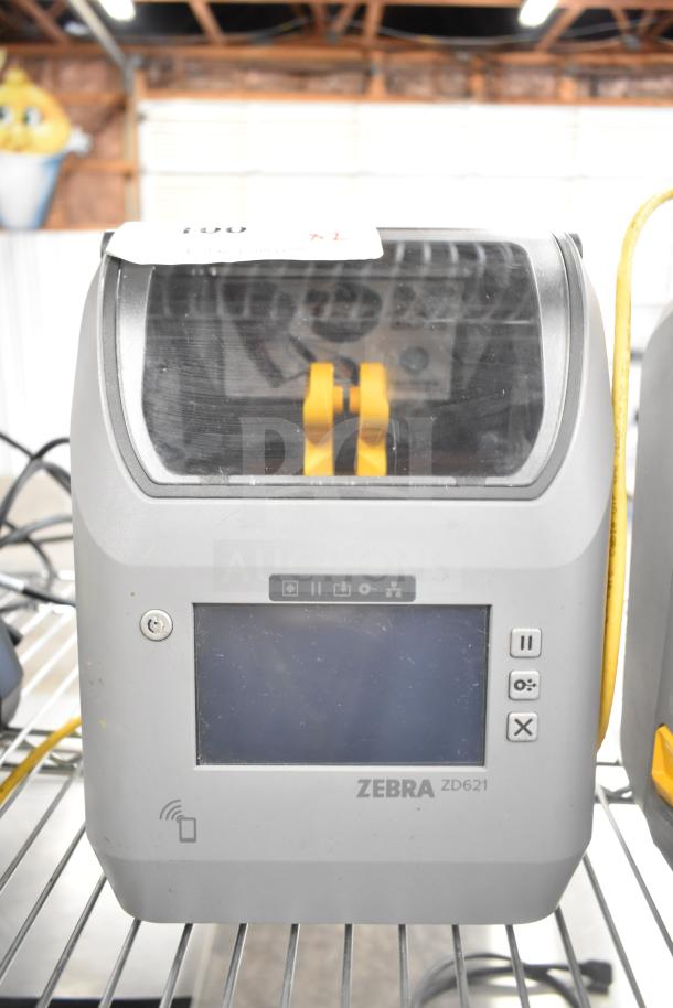 Zebra ZD621 desktop direct thermal barcode printer, touchscreen, good condition, two units available for auction.