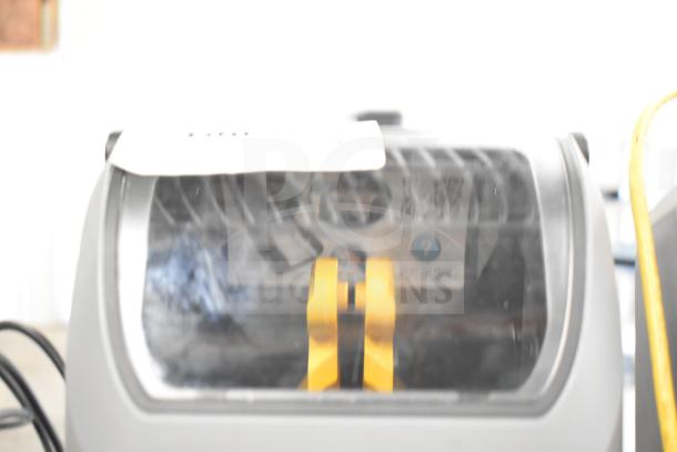 Zebra ZD621 desktop thermal barcode printer with visible QR code label, featuring a clear plastic cover and yellow components.