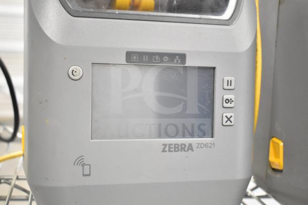 Zebra ZD621 desktop direct thermal barcode printer with touchscreen, visible logos and control buttons. Good condition.