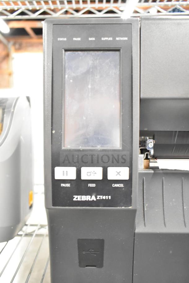 Zebra ZT411 Industrial Barcode Printer, visible screen and control buttons, in good condition.