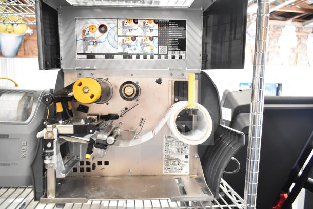 Zebra ZT411 Industrial Barcode Printer, open to show internal mechanisms and labels, in good condition.