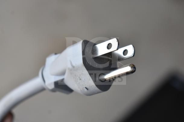 Power plug for KoolMore KM-MOT-1SS Microwave Oven, 120V, 1 Phase. Features 3 prongs for secure connection, slightly scuffed.