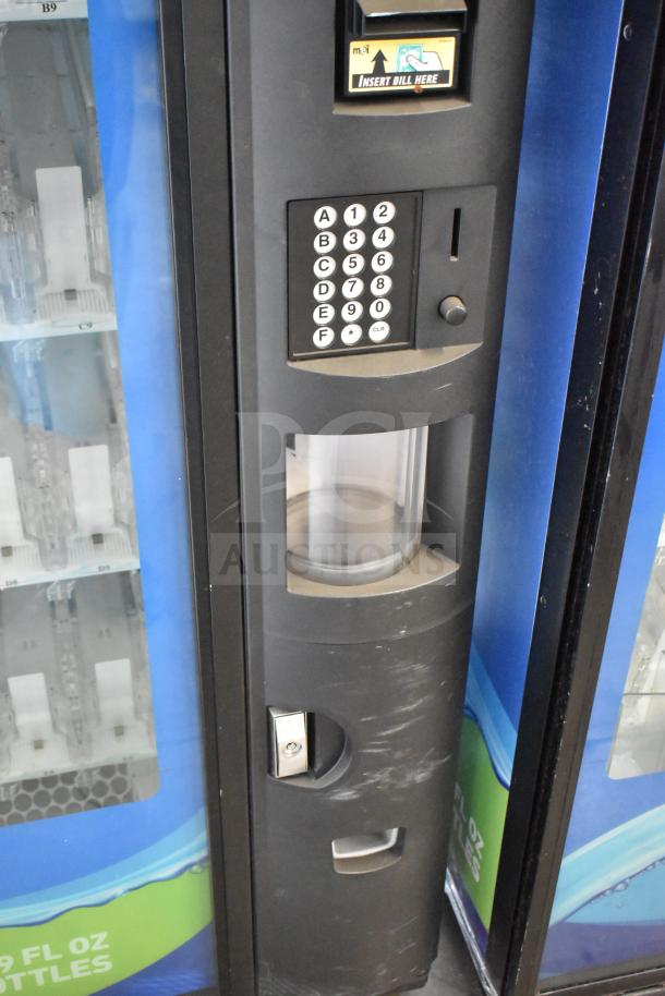 Crane 5800-4 vending machine with bill acceptor, keypad, bottle slots. Good condition, 115 volts, 1 phase.
