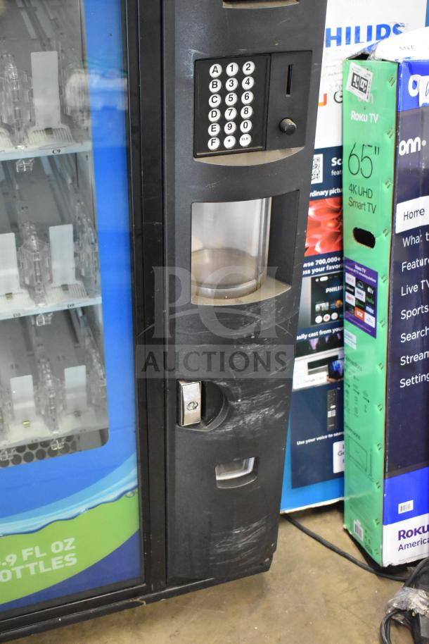 Crane 5800-4 commercial vending machine for bottled drinks, features bill acceptor, keypad, visible shelves, minor wear.