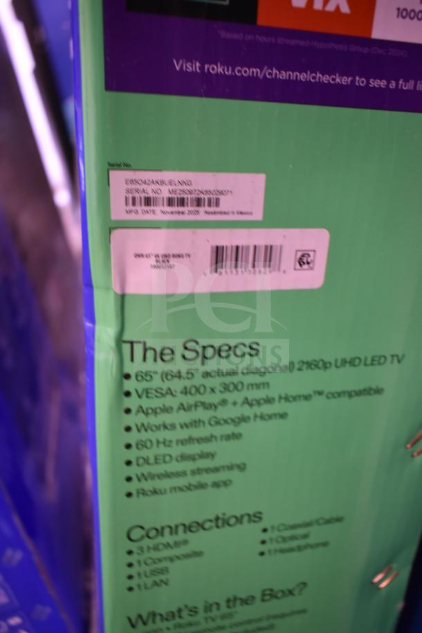 Vizio 55" and Roku 65" TVs in original boxes. Specifications visible on box: UHD, DLED display, compatible with Google Home. Condition not verified.