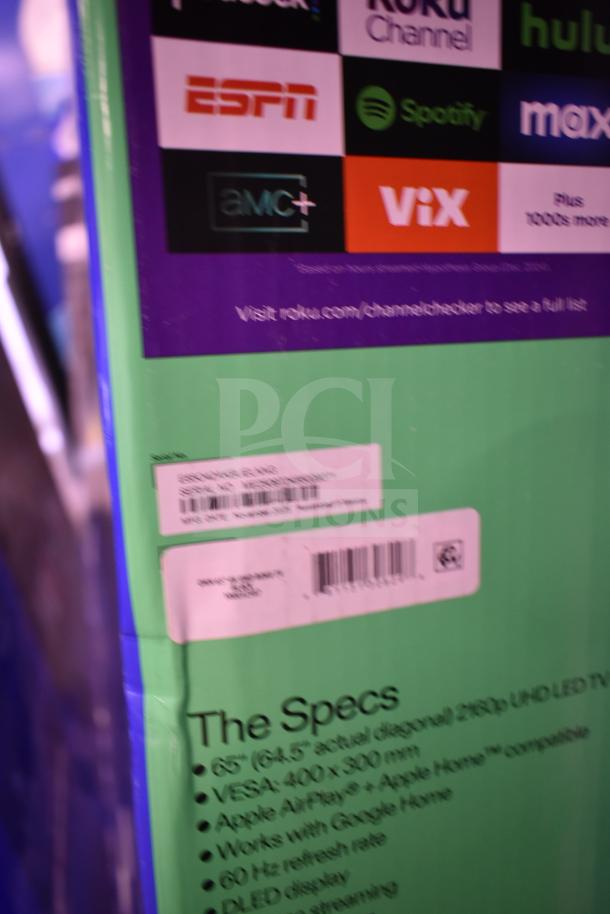 Box for Roku 65" TV showing streaming options and specs, including 65" UHD display, VESA compatibility, and Apple Home support.