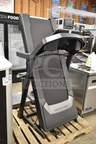 Pro Form PFTL59724.3 folding treadmill, 120V, 1 phase, in good condition, displayed upright on a pallet.