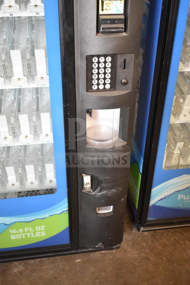 Crane 5800-4 commercial bottled drink vending machine with bill acceptor, keypad, and bottle display. 115 volts, 1 phase.