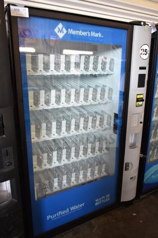 Crane 5800-4 commercial vending machine with bill acceptor. Member's Mark branding, empty display racks, 115V, 1 phase.