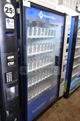 Crane 5800-4 vending machine with bill acceptor. Dispenses bottled drinks. 25¢ price, Member's Mark branding, 115V.