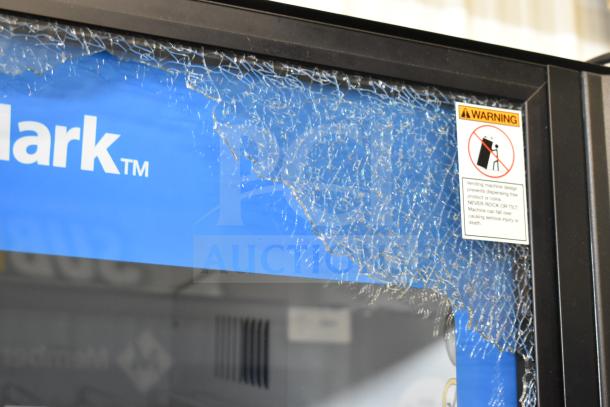 Crane 5800-4 vending machine with bill acceptor, visible glass damage, 115 volts, 1 phase. Warning label attached.