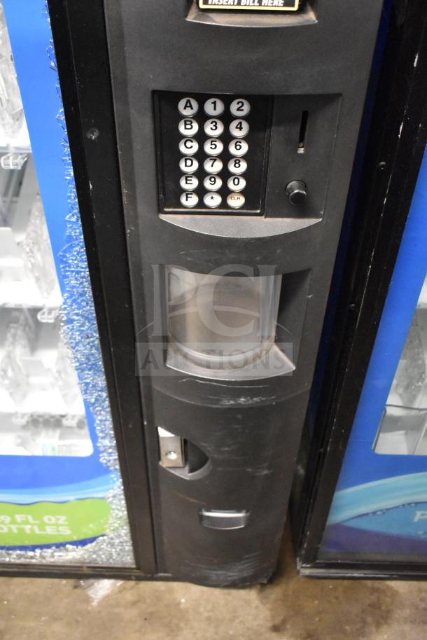 Crane 5800-4 drink vending machine with bill acceptor; visible glass damage; 115 volts, 1 phase.