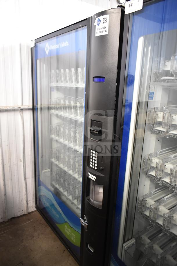 Crane 5800-4 vending machine, black, with bill acceptor. Displays asset ID 7712951139, suits 115 volts, 1 phase.