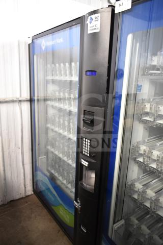 Crane 5800-4 vending machine, black, with bill acceptor. Displays asset ID 7712951139, suits 115 volts, 1 phase.