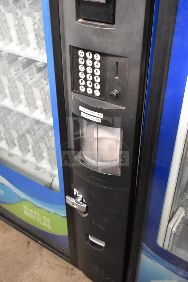 Crane 5800-4 commercial vending machine, black, equipped with bill acceptor, keypad interface, 115V, 1 Phase, good condition.