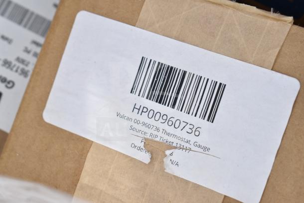 Barcode label on a package reads "HP00960736 Vulcan 00-960736 Thermostat, Gauge." Brown packaging visible.