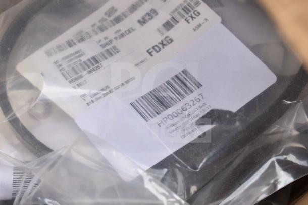 Image showing barcodes and labels on packaged items. Labels include "HP00063267" and details about parts like a "Hobart Belt."