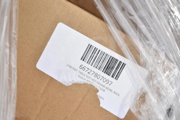 Cardboard box with a barcode and label marked "Table Top Hot Round Bowl Rack." Scratches and dents visible.