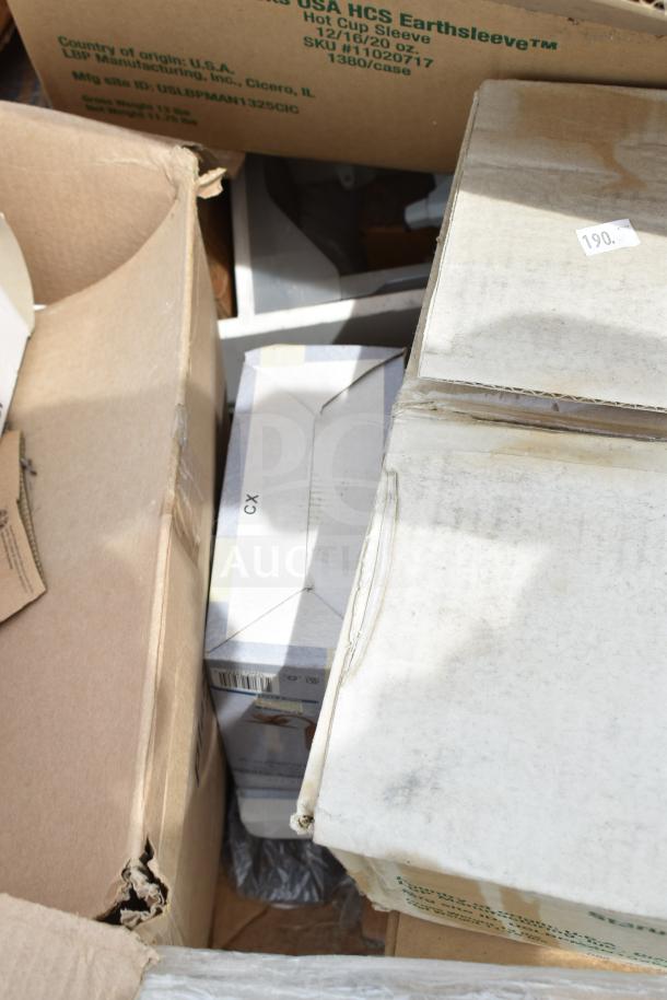 Cardboard boxes containing 20 brand new mixed items, including LBP Hot Cup Sleeves, marked for auction. Signs of minor dents.