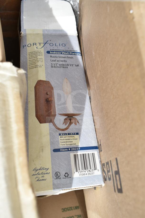 Box with Portfolio Lighting San Marcos Indoor Wall Fixture, rustic brown finish, leaf accents, 3.5" x 8.5", model #28237.