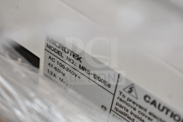 Label on Microtek Model MRS-1200E6 showing voltage and caution details. 20 brand new scratch and dent items available.