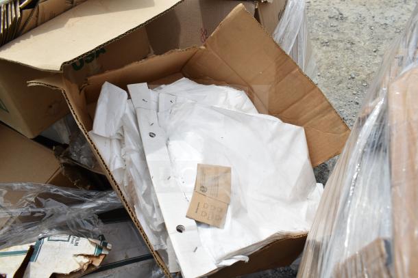 Open box with 20 brand new scratch and dent items, including white hot cup sleeves. Mixed condition, cardboard labels visible.