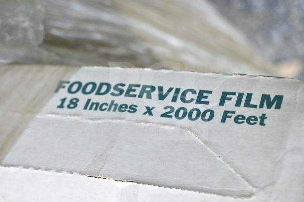 Cardboard box labeled "FOODSERVICE FILM 18 Inches x 2000 Feet," shows slight wear. Part of 20 scratch and dent items auction.